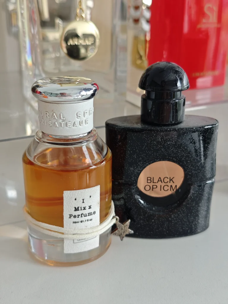 Side-by-side comparison of a $150 YSL Black Opium designer bottle and an affordable, high-concentration Extrait de Parfum alternative by Imixx.