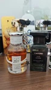 A visual representation comparing the high-fidelity fragrance profile of imixx perfume No. 48 to the established tom ford oud wood men scent DNA, highlighting comparable quality through supply chain expertise