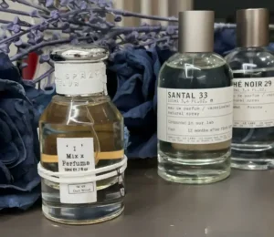 How to Find High-Quality Cheap Perfume Dupes: A US Supply Chain Expert’s Ultimate Guide 3 Laboratory comparison concept showing a premium designer-inspired perfume next to an expensive niche fragrance, both utilizing high Eau de Parfum oil concentration.