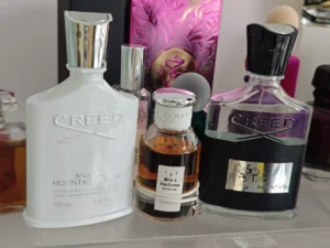 How to Find the Perfect Aventus Creed Copy in the USA: A Supply Chain Expert's Guide 3 IMIXX No.35 Extrait de Parfum bottle compared directly against traditional expensive designer fragrance packaging.