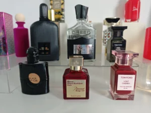 Side-by-side comparison of an expensive traditional luxury perfume and a high-quality affordable fragrance knockoff.