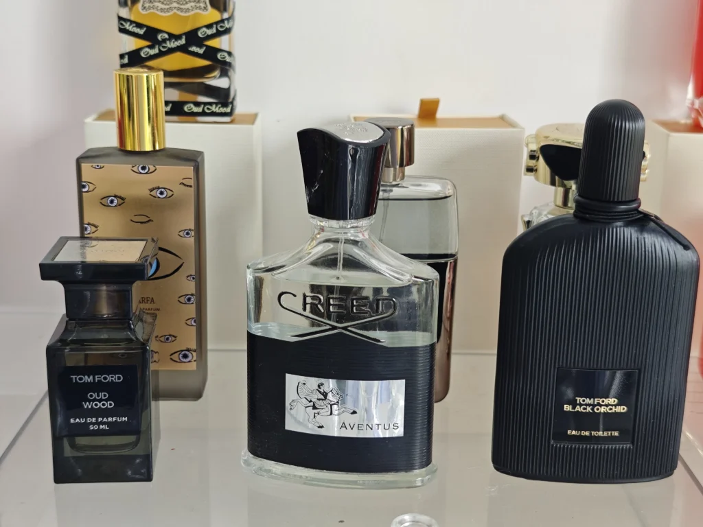 Side-by-side comparison of a $300 luxury designer cologne and a high-quality affordable dupe fragrance alternative