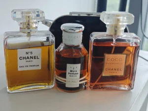 Comparing the packaging and formulation quality of a 160-dollar designer amber-floral fragrance with the cruelty-free iMIXX No. 14 Eau de Parfum.