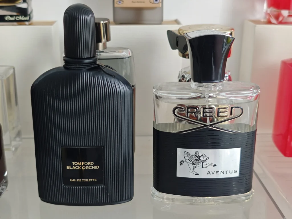 A side-by-side comparison of a $400 luxury niche fragrance and a high-quality affordable Aventus clone, highlighting the difference in retail markups.