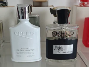 Visual breakdown comparing the scent notes and Extrait de Parfum concentration of a designer perfume versus a factory-direct Aventus dupe alternative.