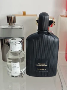 Side-by-side comparison of a luxury $180 dark floriental designer perfume and a premium factory-direct Black Orchid dupe.