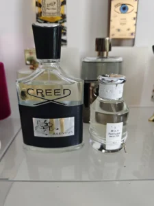 How to Choose the Best Copy of Creed Aventus Dupe in 2026 (And Stop Overpaying for Fragrances) 2 Side-by-side comparison of a $400 luxury niche cologne bottle and a direct-to-consumer high-concentration perfume alternative.