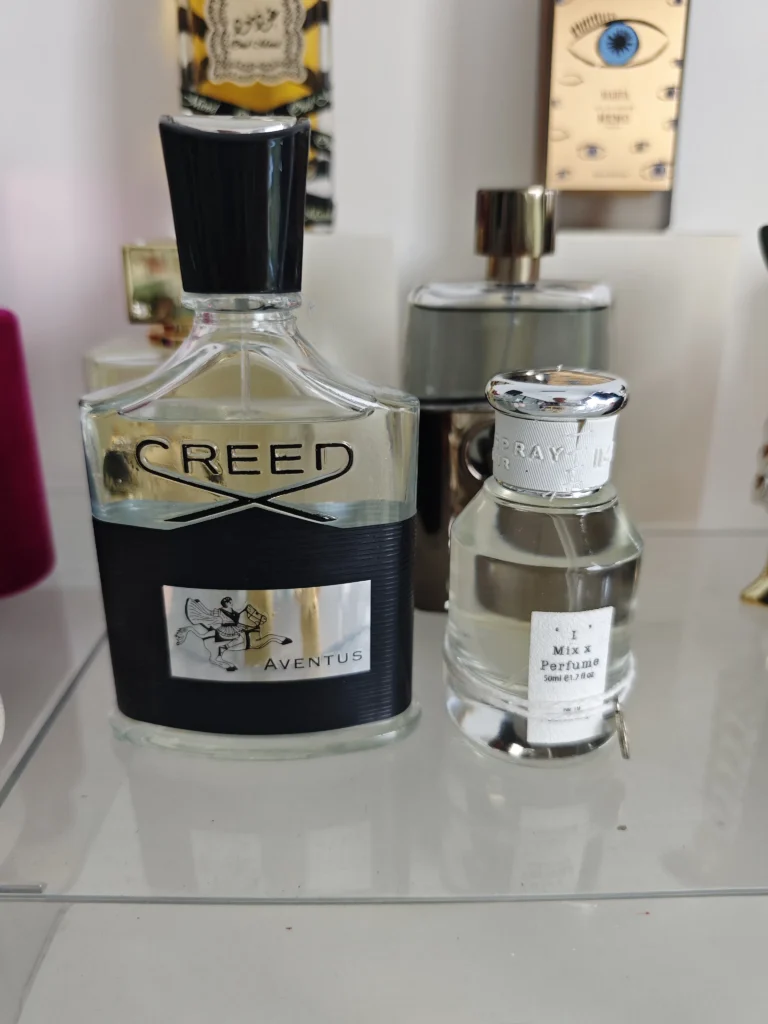 Side-by-side comparison of a $400 luxury niche cologne bottle and a direct-to-consumer high-concentration perfume alternative.