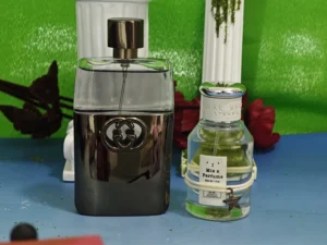 Side-by-side comparison of a $150 designer aquatic cologne and a budget-friendly alternative fragrance bottle in the USA.