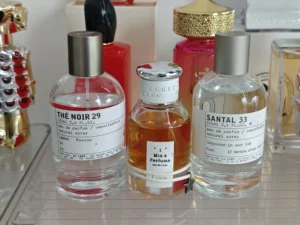 Cost and ingredient comparison between a $300 designer fragrance and a premium IMIXX long-lasting perfume dupe