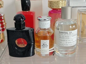 Side-by-side comparison of an expensive designer luxury perfume and a high-quality EDP perfume dupe bottle