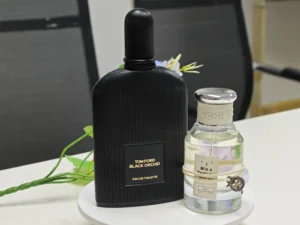 Side-by-side comparison of an expensive Tom Ford Black Orchid bottle and a premium, high-concentration affordable dupe alternative.