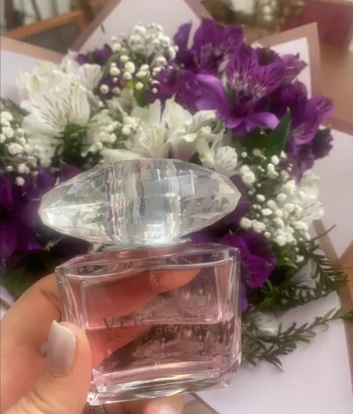 Side-by-side comparison of a luxury designer aquatic floral perfume and a high-quality Eau de Parfum Bright Crystal dupe.