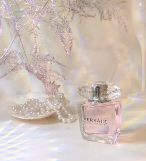 Side-by-side comparison of a traditional $120 luxury designer fragrance and a high-quality, factory-direct affordable floral perfume dupe.