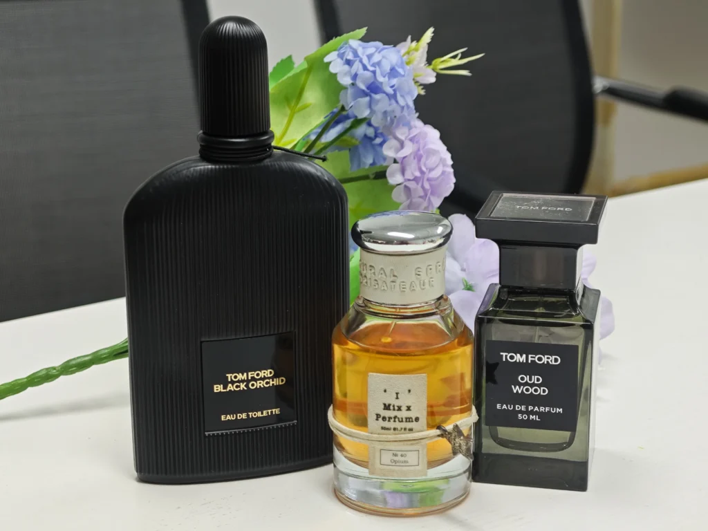 Side-by-side comparison of a $300 luxury designer men's cologne and a premium $40 fragrance dupe alternative.