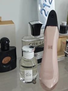 How to Find and Layer the Perfect Carolina Herrera Good Girl Dupe in the USA 3 Price and packaging comparison between a $150 designer luxury perfume and the Imixx No. 16 Extrait de Parfum bottle.