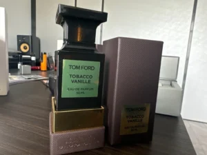 Side-by-side comparison of an expensive $375 Tom Ford Tobacco Vanille designer bottle and a clean, high-performance Extrait de Parfum alternative under $50.
