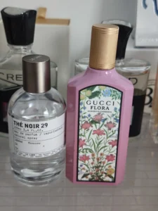 Side-by-side comparison of a $300 luxury designer fragrance bottle and a premium, long-lasting perfume dupe alternative.