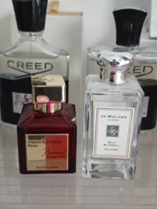 Visual breakdown comparing an expensive designer perfume to a high-quality, affordable fragrance dupe formulation.