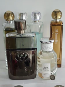 How to Get the Gucci Guilty Black Vibe for Less: A Master Perfumer’s Guide to Chemistry, Supply Chains, and Smart Alternatives 3 Evaluating aromatic fougère perfumes: traditional designer cologne bottle versus a modern factory-direct inspired alternative.